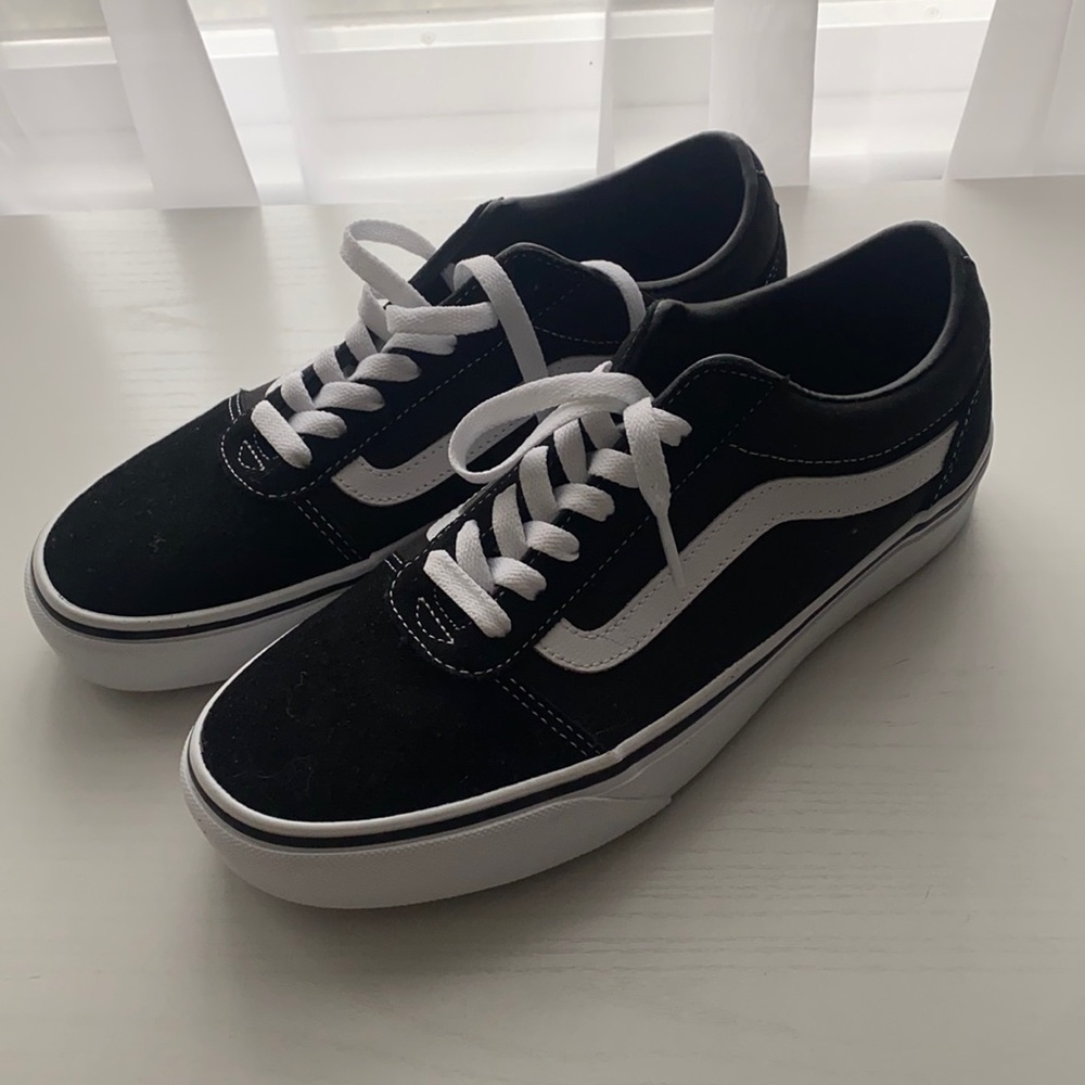 Black and white Vans. Never worn, brand new!